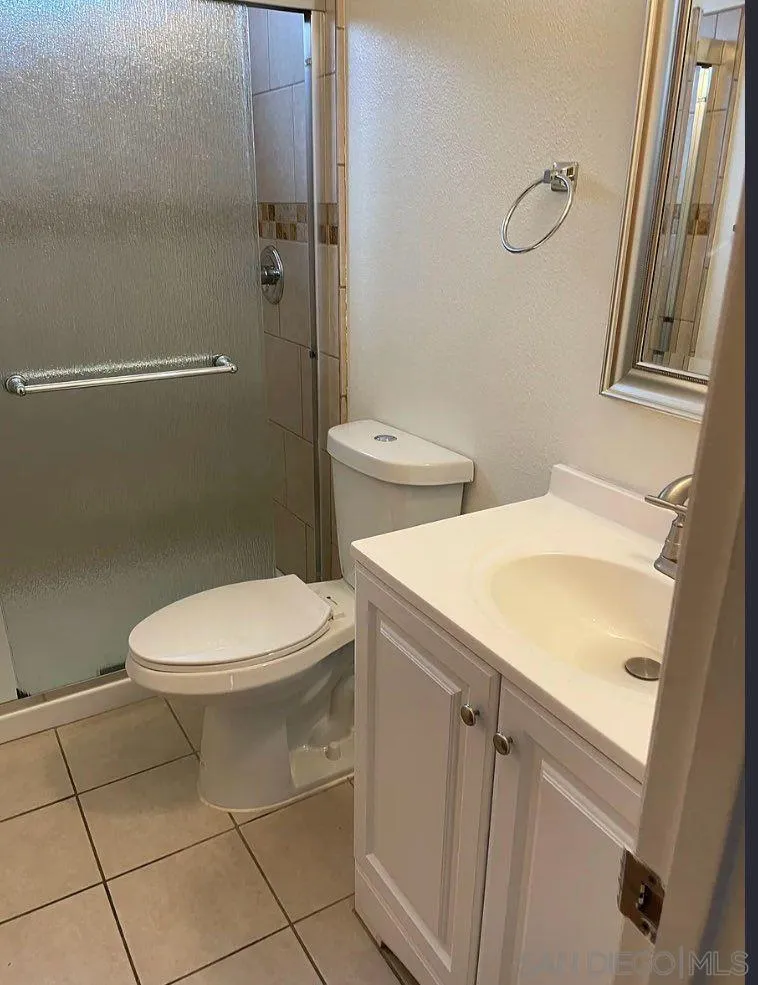 8175 Arthur Street Cotati, CA 94931 - Photo 9 of 10 a white toilet sitting next to a bathroom sink