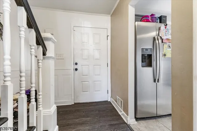 a view of closet with wooden floor