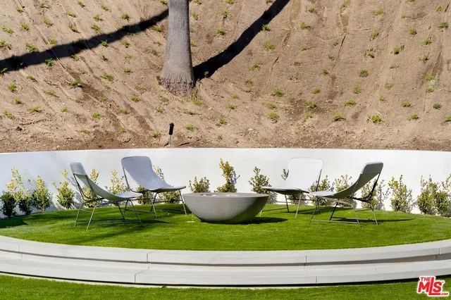a aerial view of a house with outdoor seating
