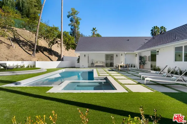 a view of a house with swimming pool