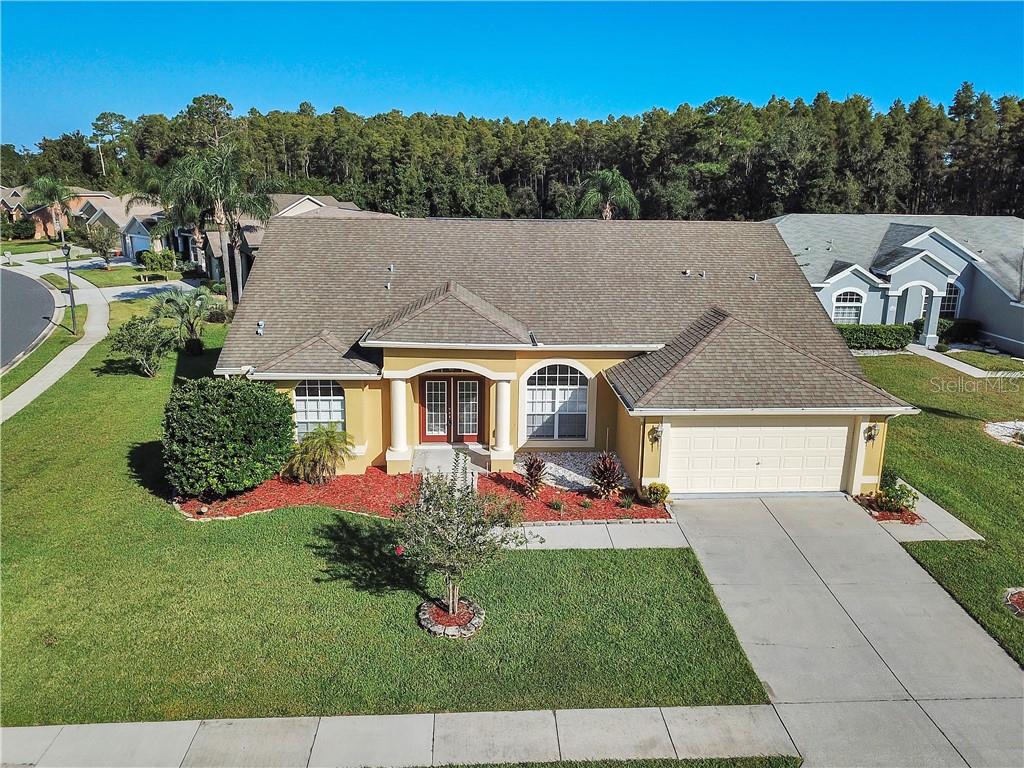 7951 Roundelay Drive New Port Richey, FL 34654 - Photo 1 of 1 Front of home sits on a nice corner lot and nicely landscaped.