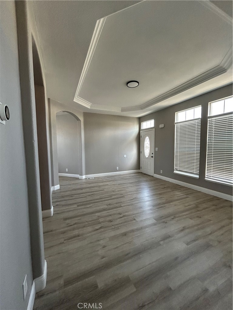 10550 Western Avenue, Unit 32 Stanton, CA 90680 - Photo 11 of 31 en empty room with wooden floor and windows