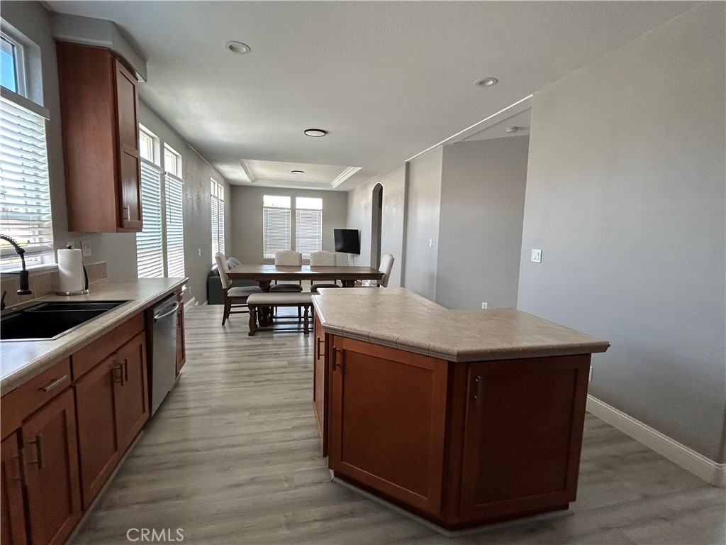 10550 Western Avenue, Unit 32 Stanton, CA 90680 - Photo 15 of 31 a kitchen with stainless steel appliances granite countertop a kitchen island a stove a sink a refrigerator and cabinets