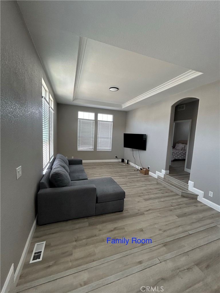 10550 Western Avenue, Unit 32 Stanton, CA 90680 - Photo 16 of 31 a living room with furniture and a flat screen tv