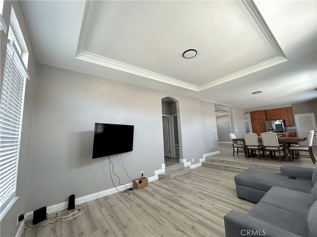 10550 Western Avenue, Unit 32 Stanton, CA 90680 - Photo 23 of 31 a living room with furniture and a flat screen tv