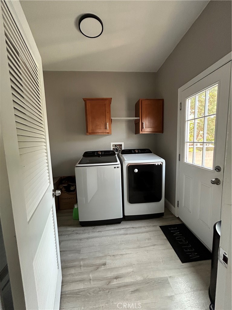 10550 Western Avenue, Unit 32 Stanton, CA 90680 - Photo 26 of 31 a utility room with wooden floor washer and dryer