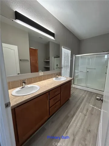 a bathroom with a double vanity sink mirror and double