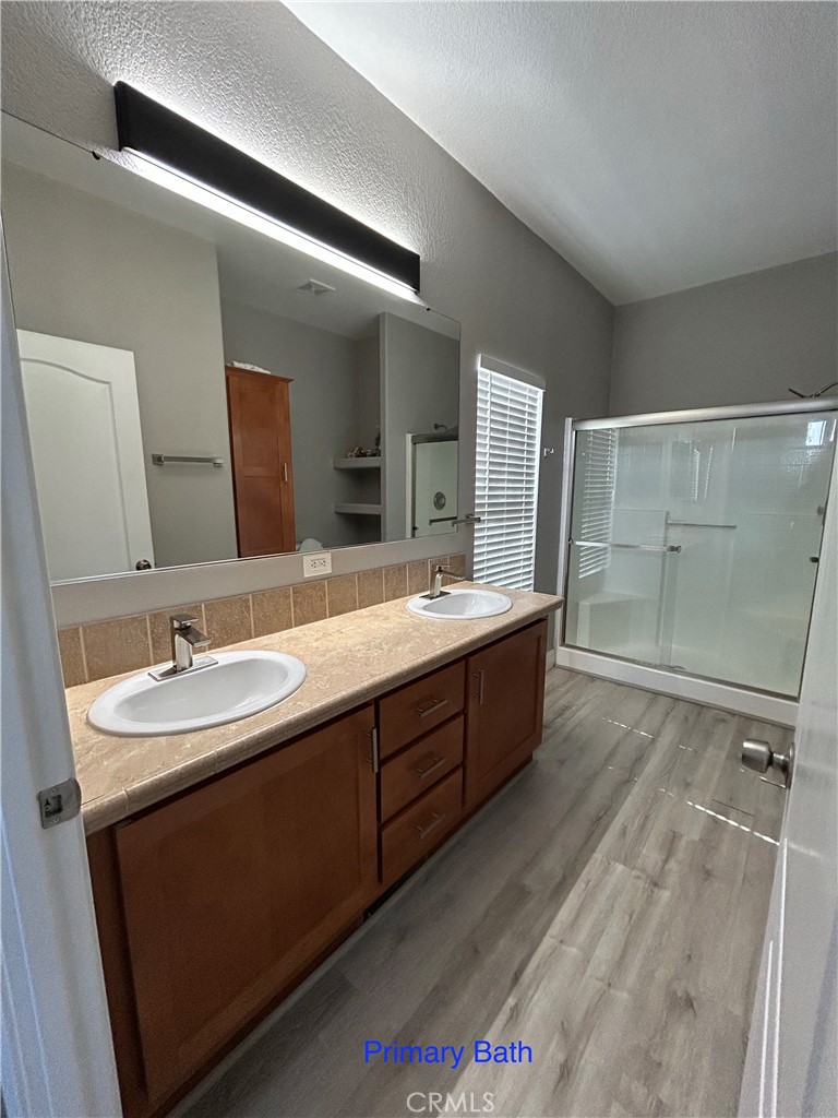 10550 Western Avenue, Unit 32 Stanton, CA 90680 - Photo 9 of 31 a bathroom with a double vanity sink mirror and double