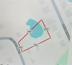 a picture of a room with stairs and a ceiling fan