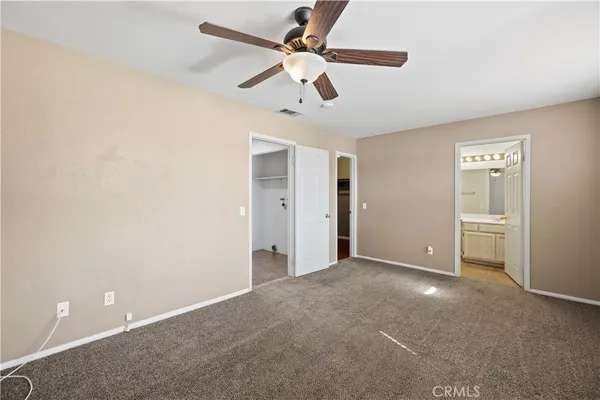 a view of a livingroom with a ceiling fan and a ceiling fan