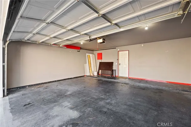 a view of empty room with red walls
