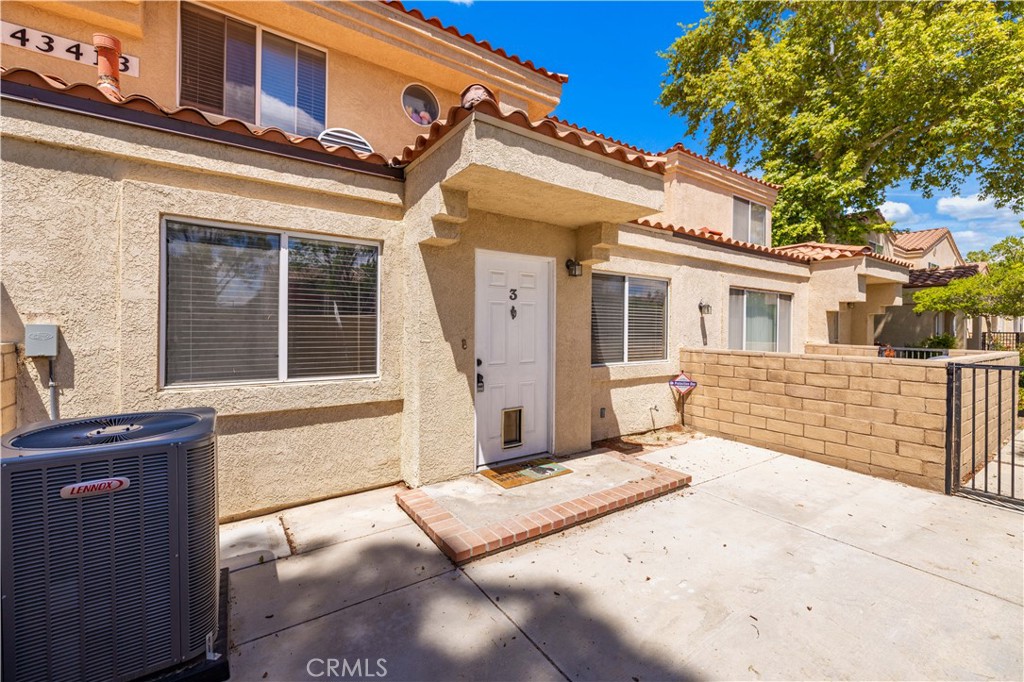 43413 30th Street West, Unit 3 Lancaster, CA 93536 - Photo 8 of 38 a view of a building with a large window