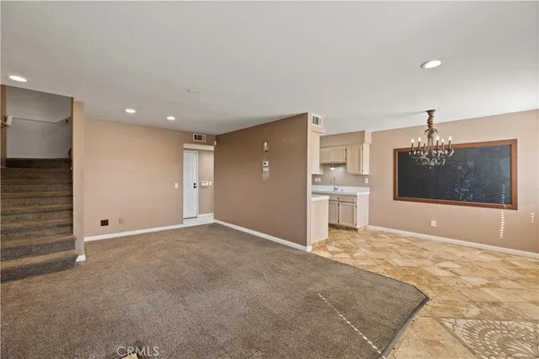 a view of a kitchen with a sink and cabinets