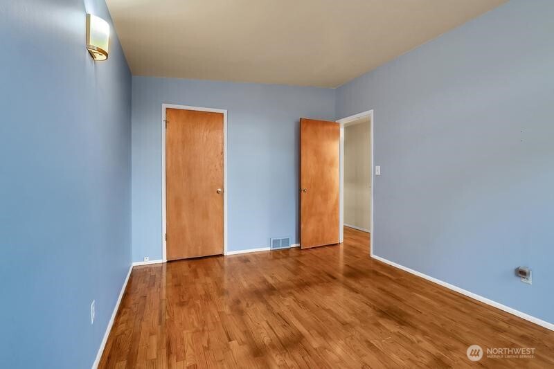 18822 Olympic View Drive Edmonds, WA 98020 - Photo 11 of 20 a view of an empty room with wooden floor
