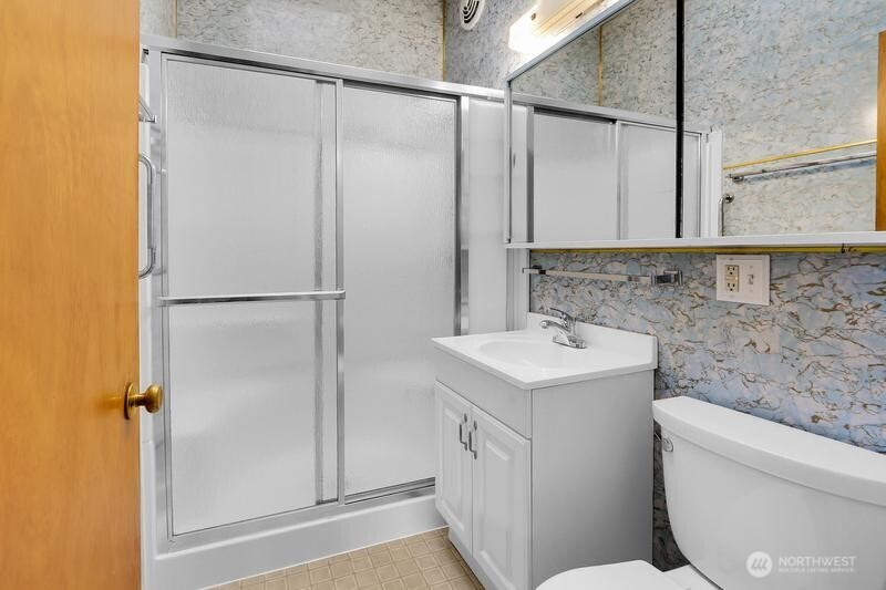 18822 Olympic View Drive Edmonds, WA 98020 - Photo 13 of 20 a bathroom with a sink toilet and shower