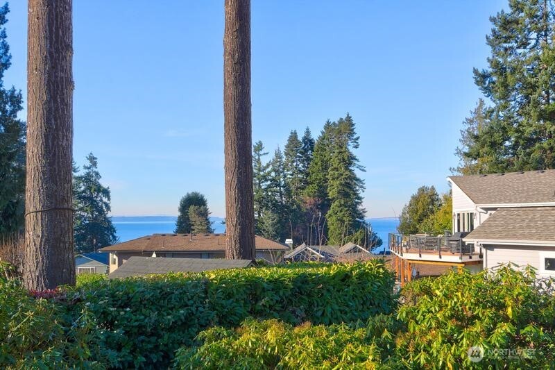 18822 Olympic View Drive Edmonds, WA 98020 - Photo 15 of 20 a view of a tall building with a small yard and plants