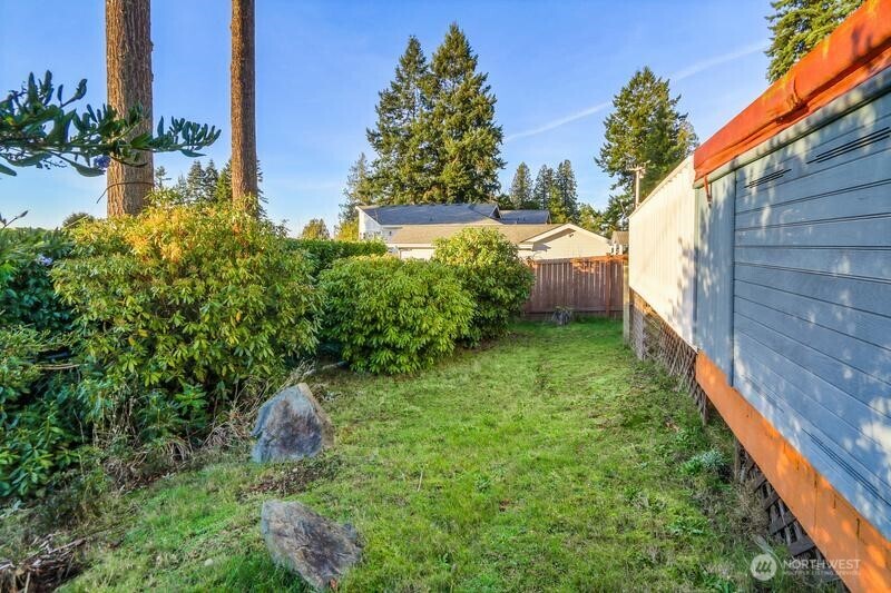 18822 Olympic View Drive Edmonds, WA 98020 - Photo 18 of 20 a backyard of a house with lots of green space
