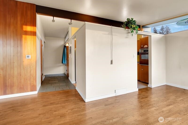 18822 Olympic View Drive Edmonds, WA 98020 - Photo 3 of 20 a view of hallway with wooden floor and stairs