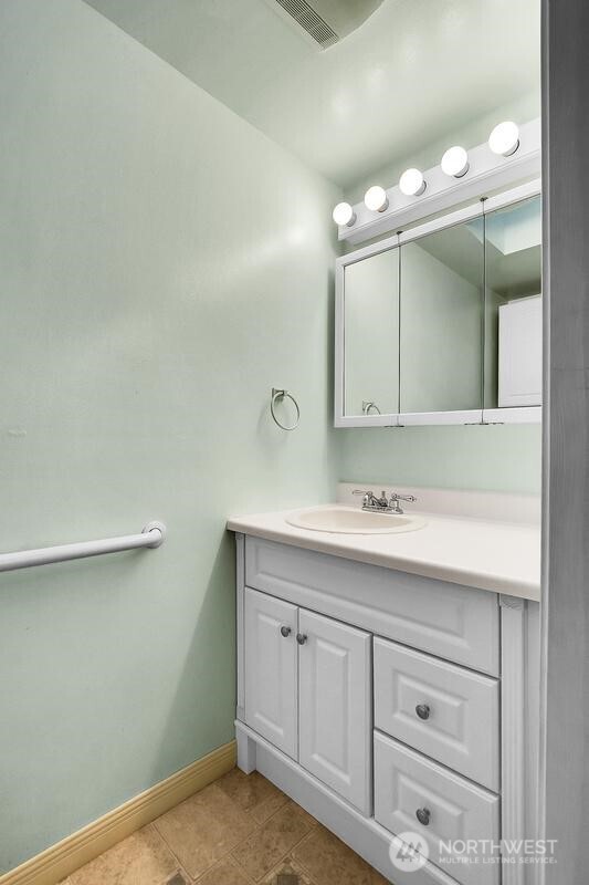 18822 Olympic View Drive Edmonds, WA 98020 - Photo 9 of 20 a bathroom with a sink vanity and mirror