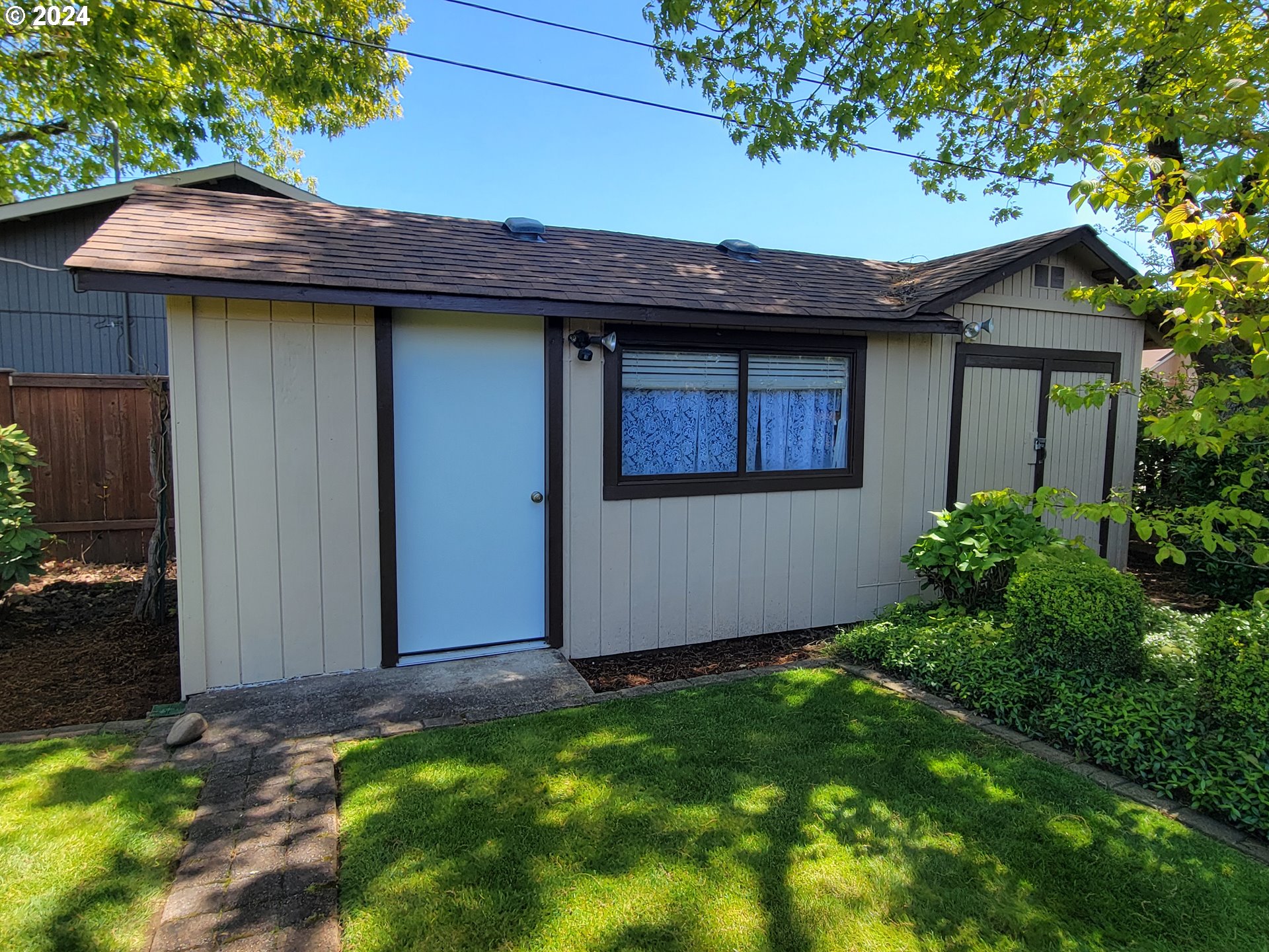 2565 Newcastle Street Eugene, OR 97404 - Photo 14 of 38 a view of a house with a yard plants and large tree
