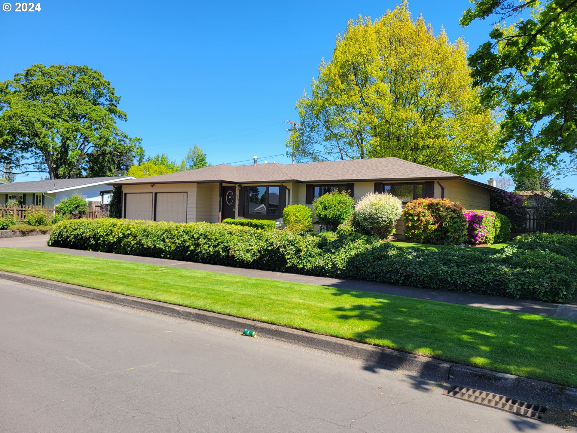 2565 Newcastle Street Eugene, OR 97404 - Photo 2 of 38 a view of a house with a garden