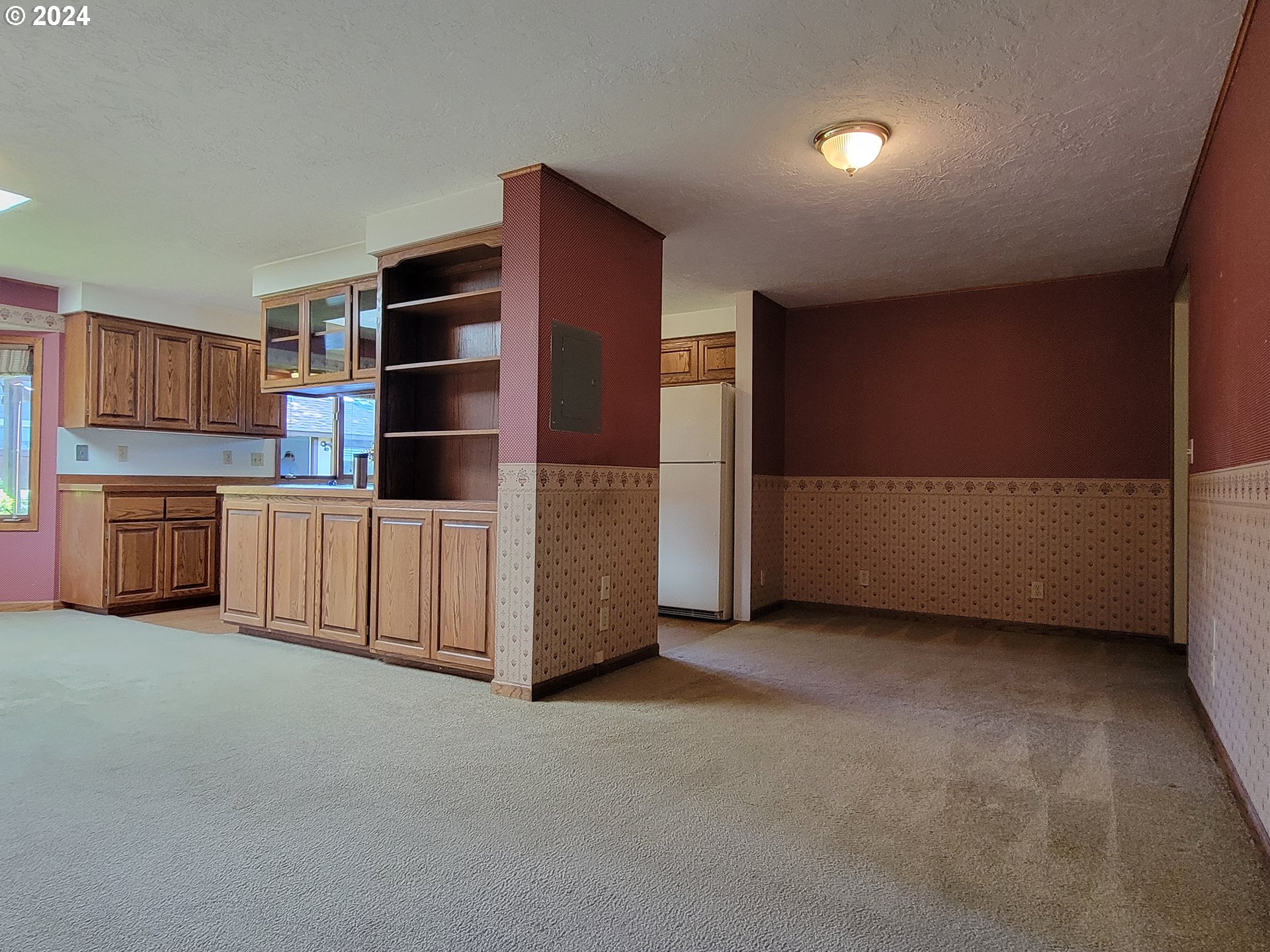 2565 Newcastle Street Eugene, OR 97404 - Photo 22 of 38 a view of kitchen with refrigerator and cabinets