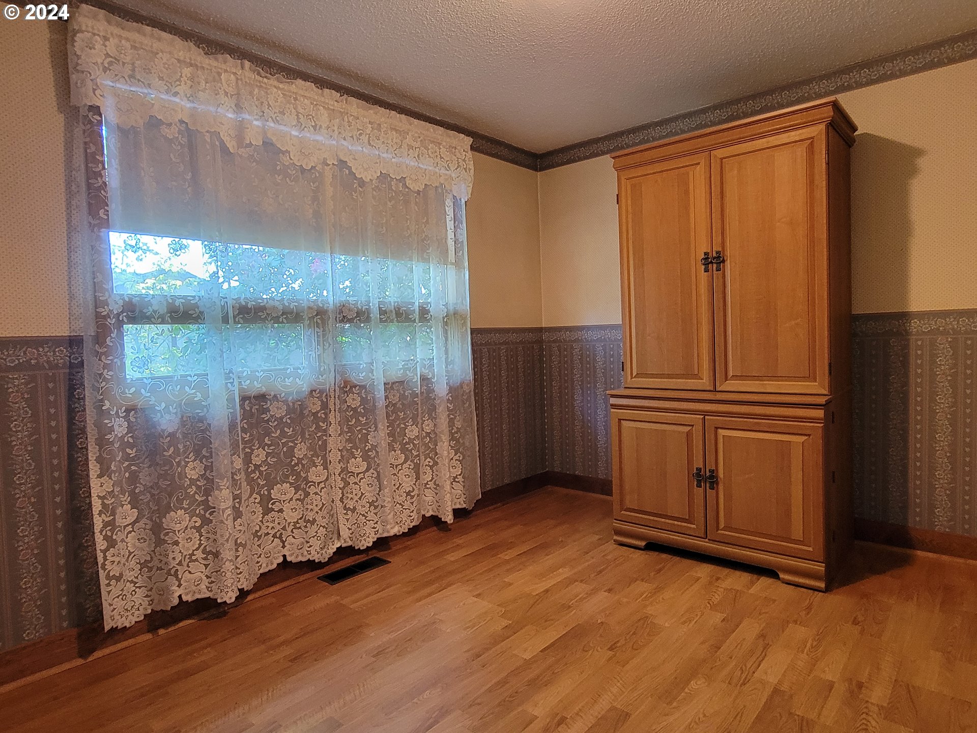 2565 Newcastle Street Eugene, OR 97404 - Photo 35 of 38 a view of front door with wooden floor