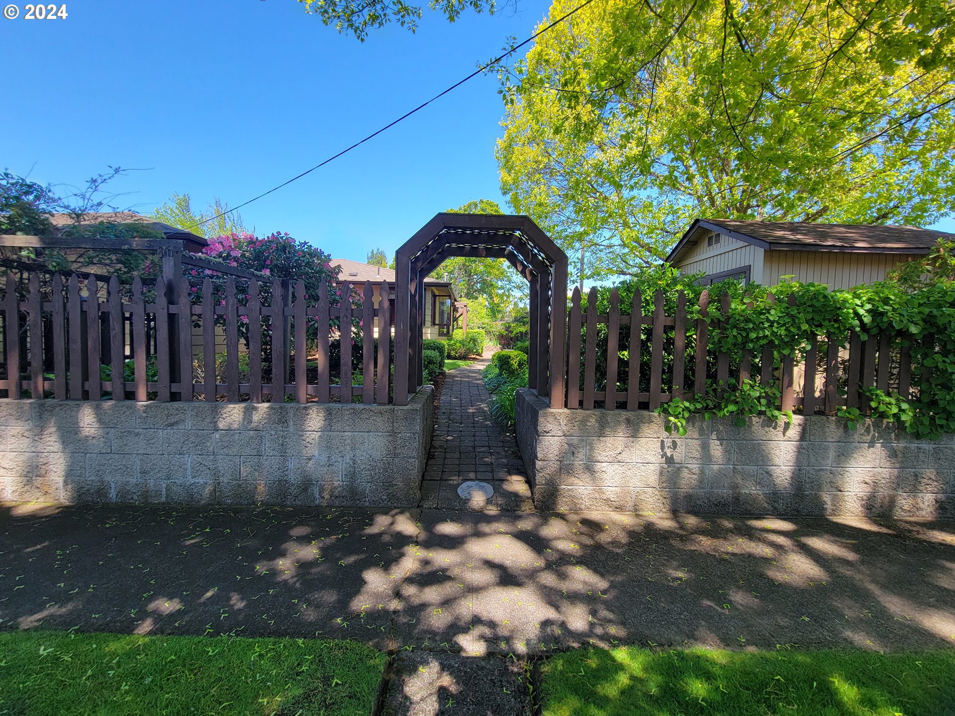 2565 Newcastle Street Eugene, OR 97404 - Photo 5 of 38 a view of a street with large trees