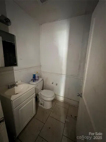 a bathroom with a toilet and a sink
