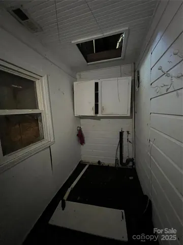 a close up of a microwave and an empty room