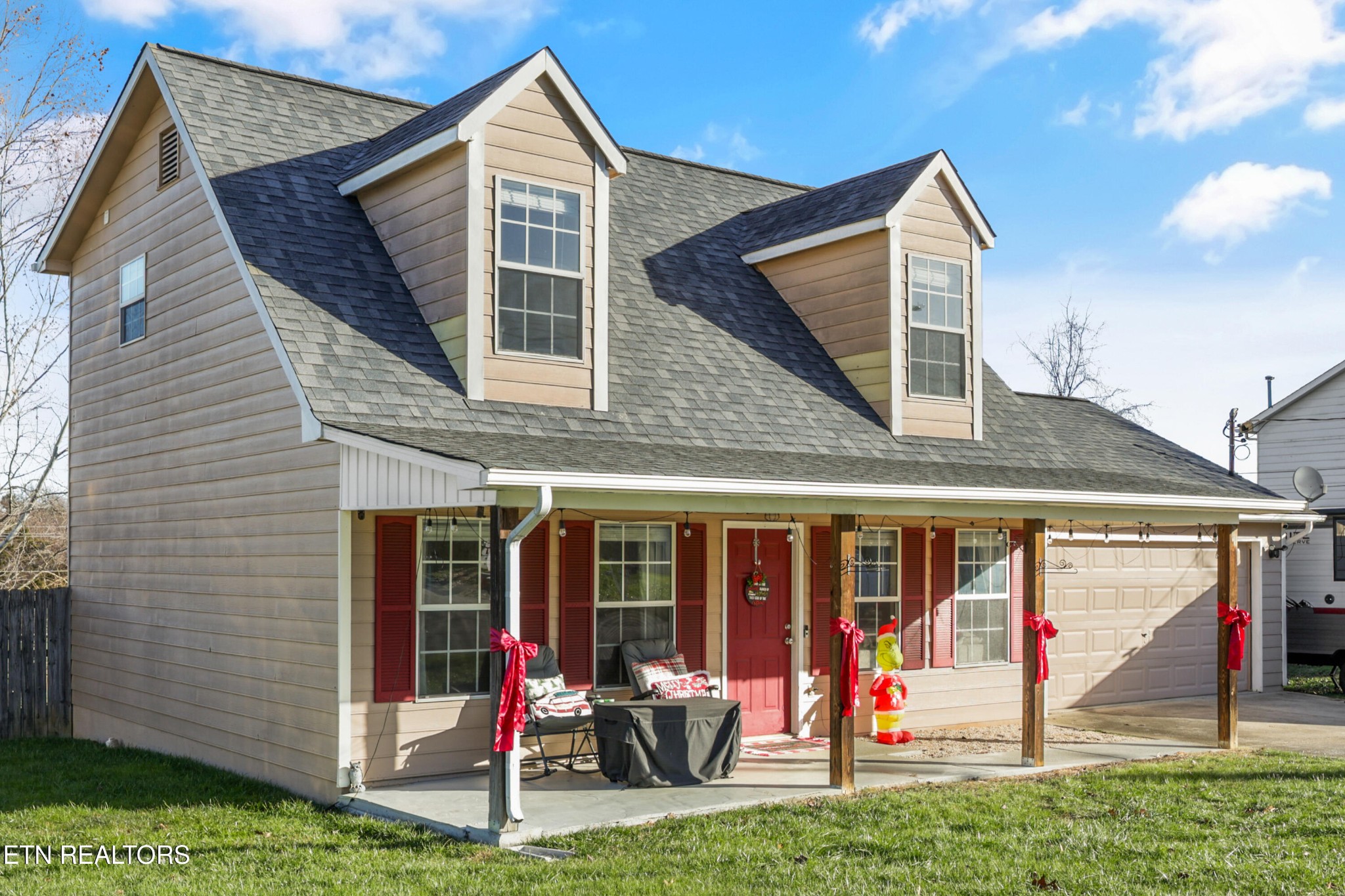 2312 Crestpark Road Knoxville, TN 37912 - Photo 1 of 33 a view of a house with floor to ceiling windows and yard