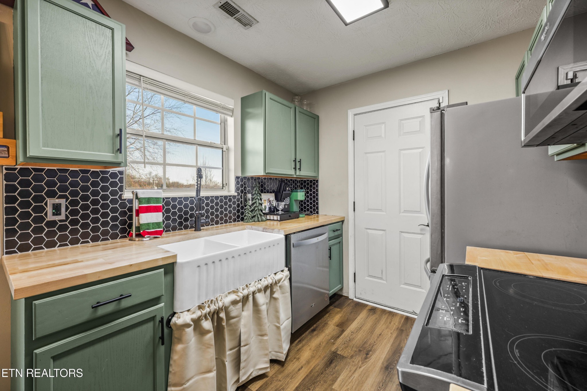 2312 Crestpark Road Knoxville, TN 37912 - Photo 14 of 33 a kitchen with a sink and a refrigerator