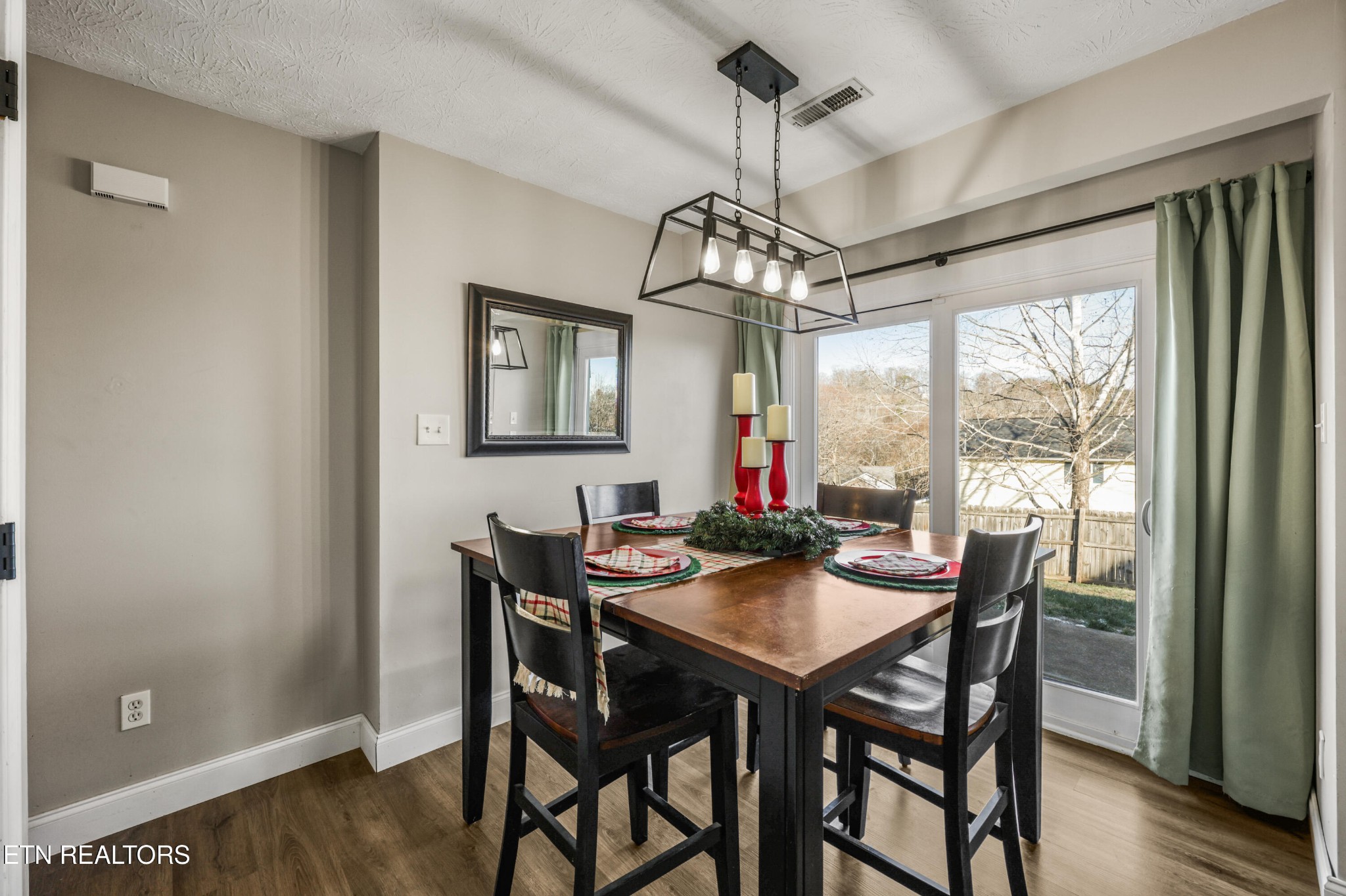 2312 Crestpark Road Knoxville, TN 37912 - Photo 17 of 33 a view of a dining room with furniture window and wooden floor