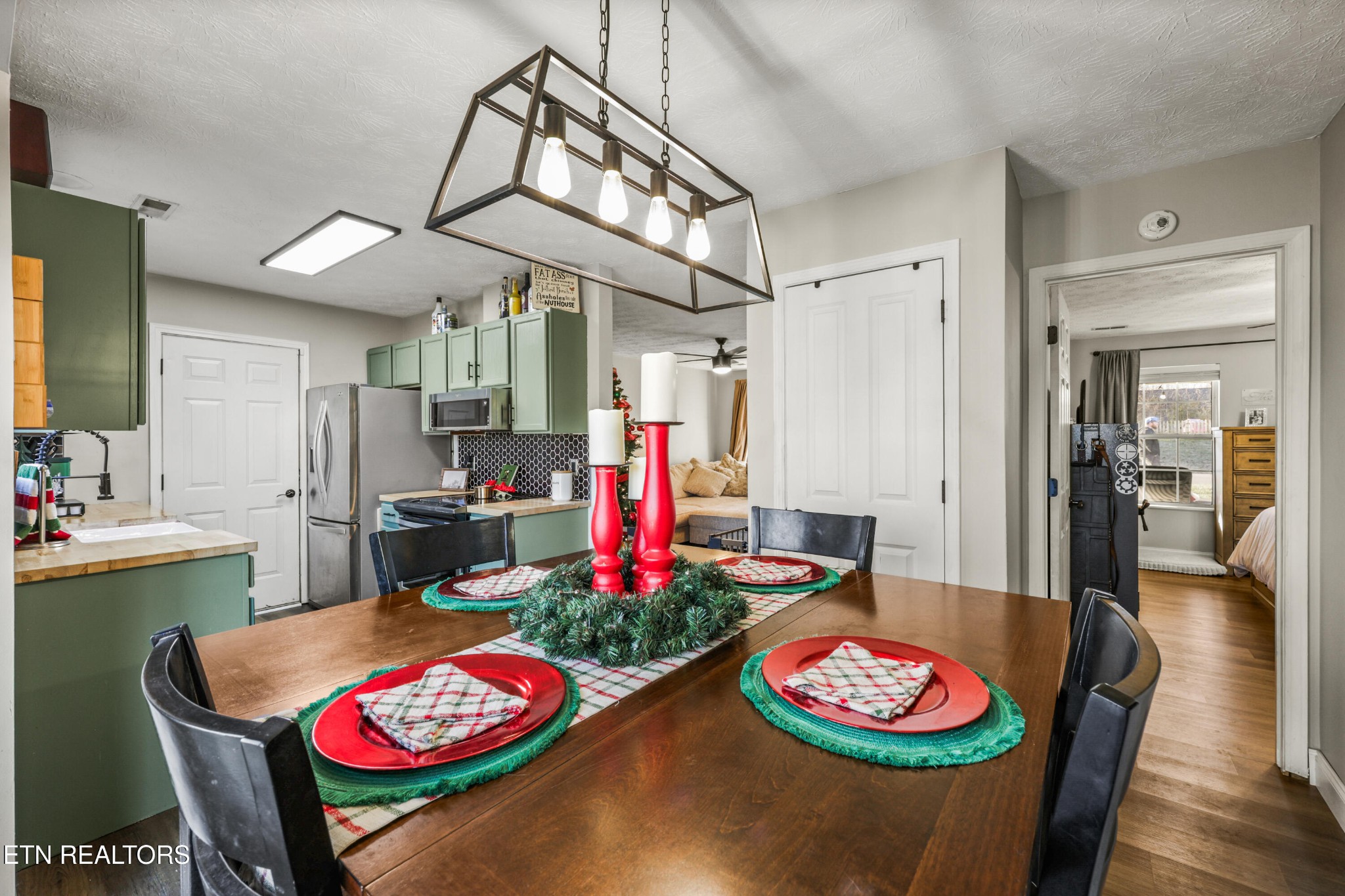 2312 Crestpark Road Knoxville, TN 37912 - Photo 20 of 33 a kitchen with granite countertop lots of clutter and stainless steel appliances