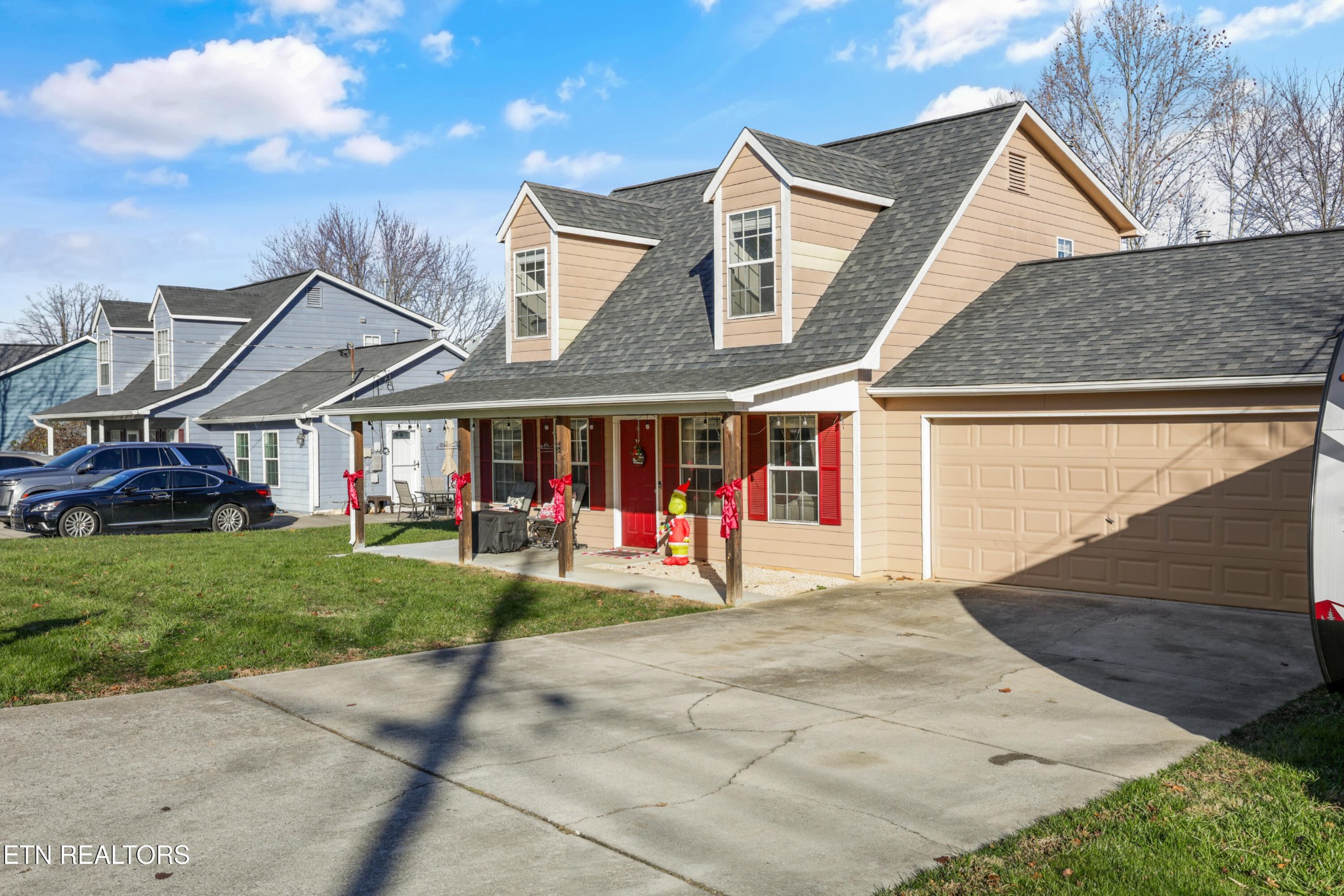 2312 Crestpark Road Knoxville, TN 37912 - Photo 2 of 33 a view of a big house with wooden walls and a yard