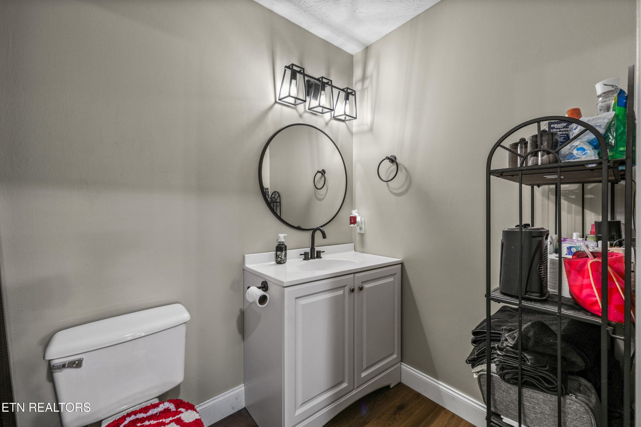 2312 Crestpark Road Knoxville, TN 37912 - Photo 24 of 33 a bathroom with a toilet mirror and vanity