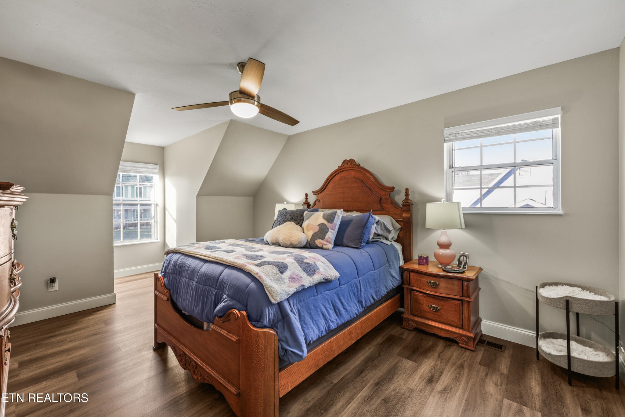 2312 Crestpark Road Knoxville, TN 37912 - Photo 26 of 33 a bedroom with a bed and a chandelier