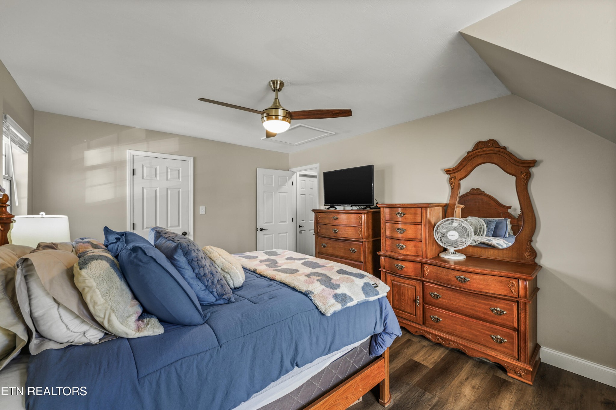 2312 Crestpark Road Knoxville, TN 37912 - Photo 27 of 33 a bedroom with a bed and a flat screen tv