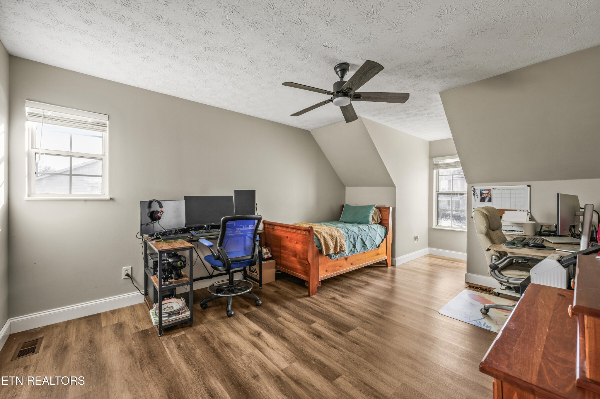2312 Crestpark Road Knoxville, TN 37912 - Photo 29 of 33 a living room with furniture and a wooden floor