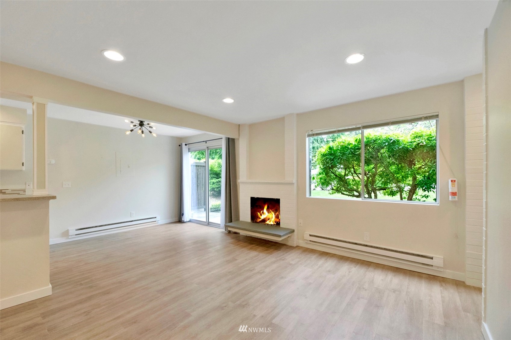 504 214th Street Southwest, Unit 23B Bothell, WA 98021 - Photo 5 of 23 wooden floor in an empty room with a window