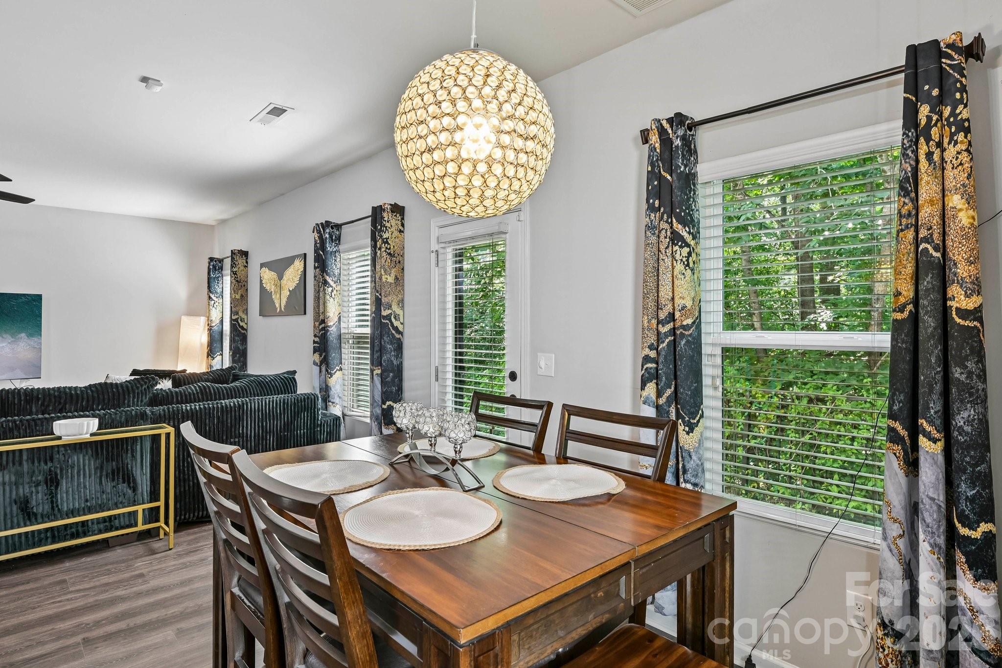 2206 Turtle Point Road Charlotte, NC 28262 - Photo 7 of 28 a view of a dining room with furniture window and wooden floor