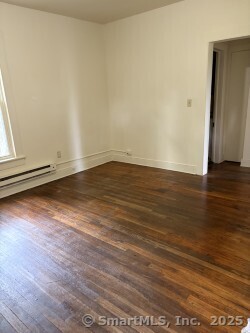 22 Dr Aaron B Samuels Boulevard, Unit 2 Danbury, CT 06810 - Photo 9 of 10 a view of an empty room with wooden floor and a window