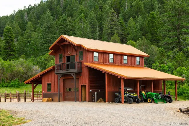 a front view of a house with a yard and table and chair
