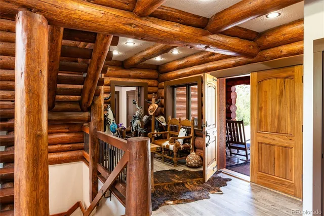 a view of an entryway with wooden floor