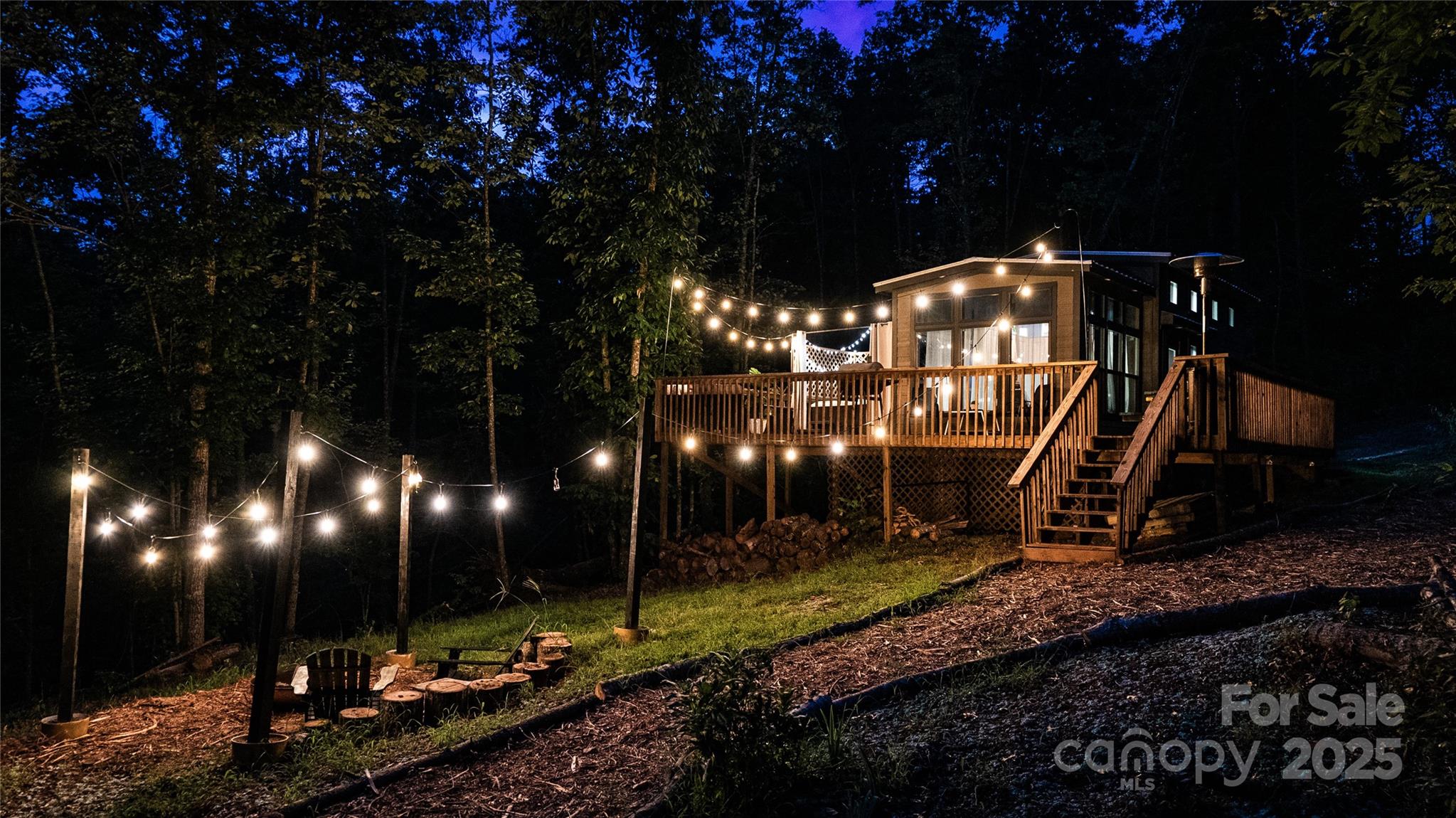 221 Summerfield Lane Rutherfordton, NC 28139 - Photo 16 of 37 a view of a fountain in the backyard of the house