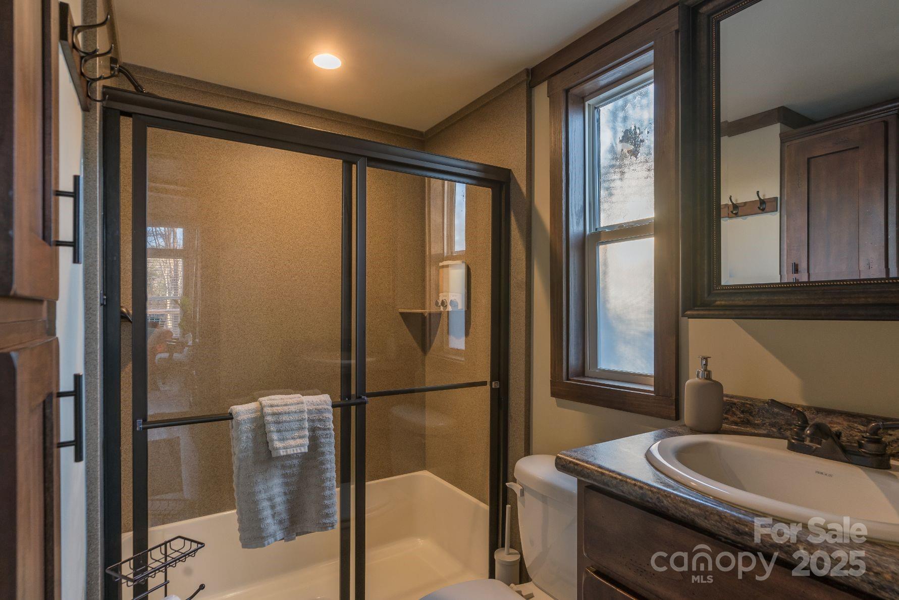 221 Summerfield Lane Rutherfordton, NC 28139 - Photo 26 of 37 a bathroom with a sink and a mirror