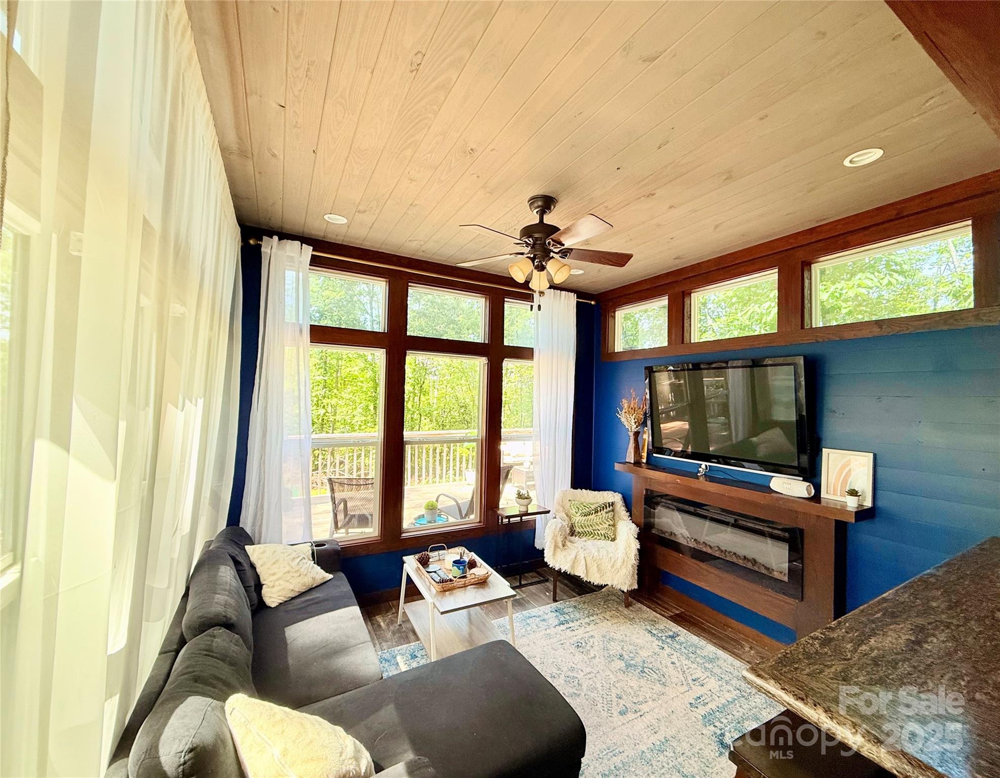 221 Summerfield Lane Rutherfordton, NC 28139 - Photo 9 of 37 a living room with furniture and a flat screen tv