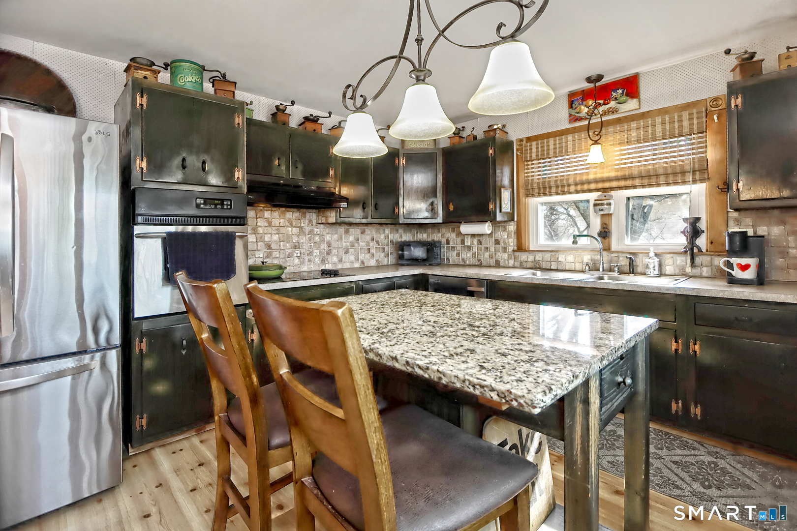 6 Mt Pleasant Road West Haven, CT 06516 - Photo 11 of 40 a kitchen with a table and chairs in it