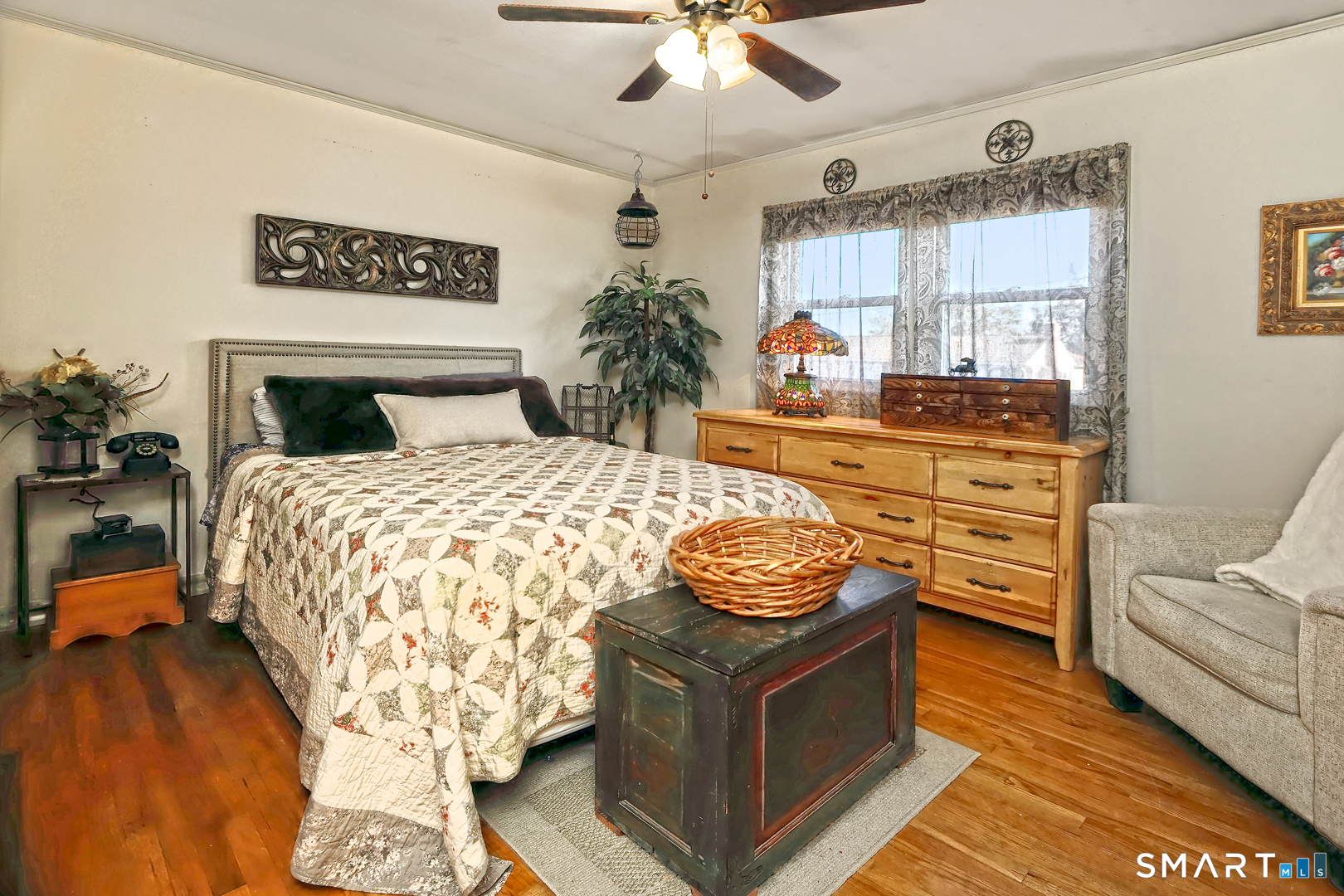 6 Mt Pleasant Road West Haven, CT 06516 - Photo 14 of 40 a bedroom with a bed and a chandelier