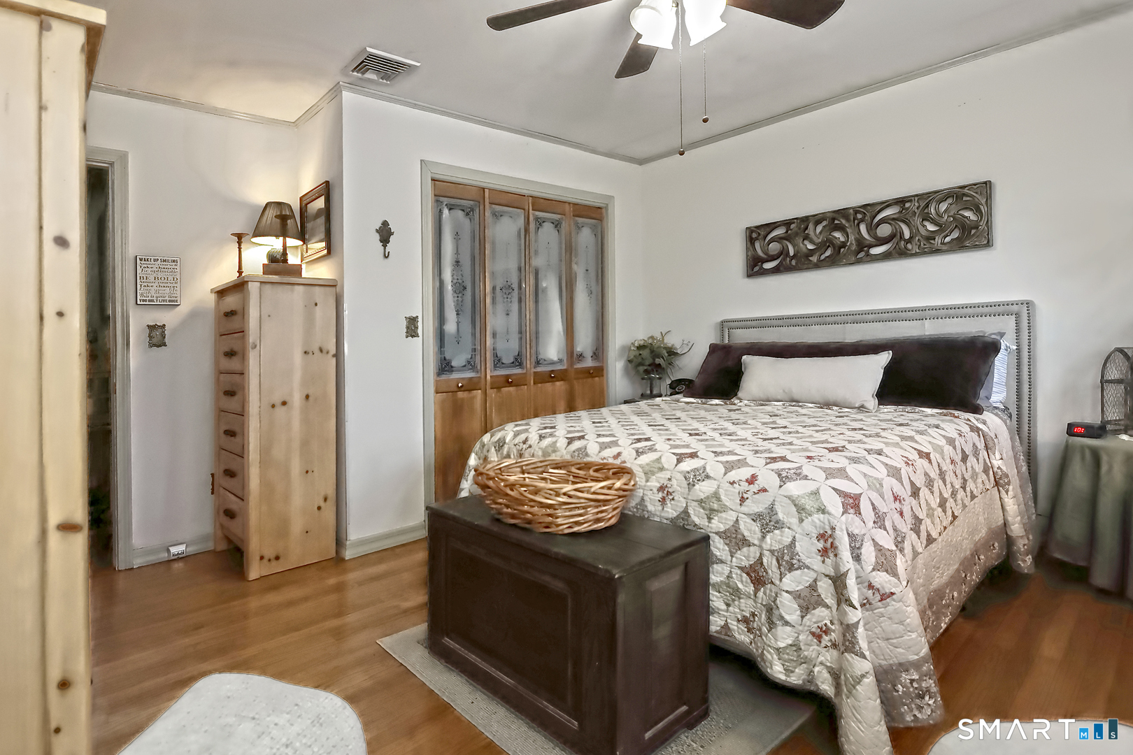 6 Mt Pleasant Road West Haven, CT 06516 - Photo 16 of 40 a bedroom with a bed and a chandelier